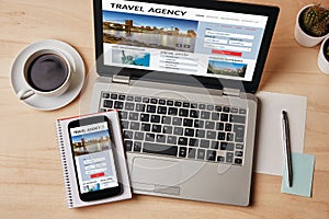 Travel agency concept on laptop and smartphone screen