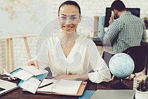 Travel Agent Holding Tickets in Travel Agency.