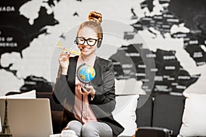 Travel agent portrait on the world map background