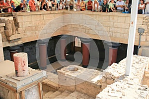Travel around Europe by car. An ancient ruins of Greek Knossos palace and group of tourists.