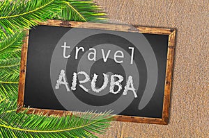 Travel Aruba palm trees and blackboard on sandy beach