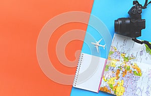 Travel background concept / Planning Essential vacation trip items in backpacks travel accessories with camera map and notebook