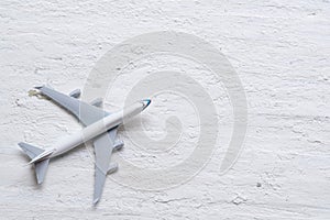 Travel background concept. Top view of airplane model decor on r