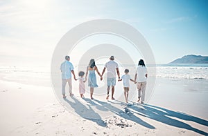 Travel, beach and family walking on sand together at the sea or ocean bonding for love, care and happiness. Happy, sun