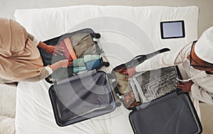 Travel, bedroom and Muslim couple with suitcase packing for holiday, vacation and religious trip. Home, luggage and