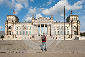 Travel in Berlin, tourist man looking at Bundestag building in Berlin, Germany