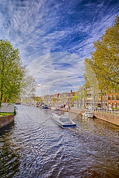 Travel Boat In One of the Multiple Channels of Harlem City in The Netherlands