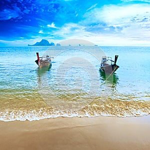 Travel boat on Thailand island beach. Tropical coast Asia landscape background