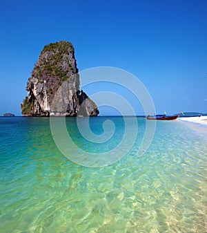 Travel boat on Thailand island beach. Tropical coast Asia landscape background