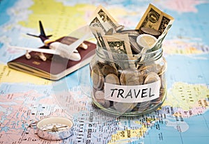 Travel budget concept with compass, passport and aircraft toy