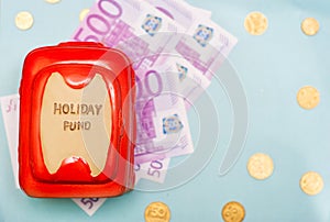 Travel budget - vacation money savings in money box. photo