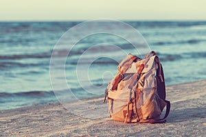 Travel Canvas Backpack on Sea Beach.