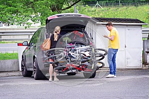 Travel car and camping luggage packed in the full car trunk. Outdoor wanderlust items.Outdoor, adventures and travel suv