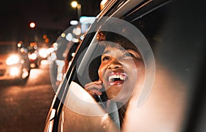 Travel, car and night, black woman and phone call, city view and communication with drive and smile on face