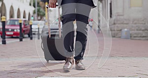 Travel, carry on suit and feet walking in a city, man making his way to meeting in town. Closeup of a formal tourist