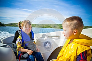 Travel of children on water in the boat