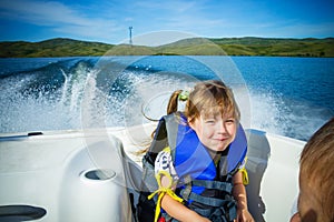 Travel of children on water in the boat