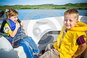 Travel of children on water in the boat