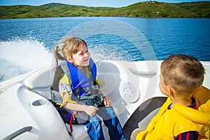 Travel of children on water in the boat