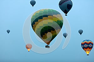 Travel. Colorful Hot Air Balloons Flying In Blue Sky In Morning