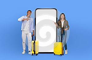 Travel companions with oversized phone and luggage