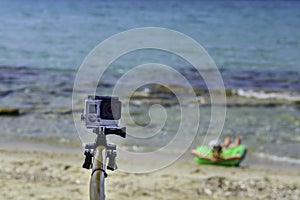 Travel concept - Action camera photography over sea view, with selfie Monopod