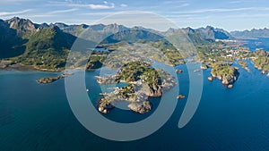 Travel concept with aerial panorama of Norwegian fiords with sea and mountains photo
