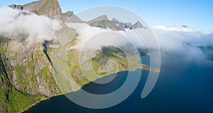 Travel concept with aerial panorama of Norwegian fiords with sea and mountains photo
