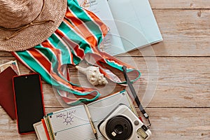 Travel concept banner flat lay.Items for summer vacation: passport,swimsuit,hat,money,map of Spain, camera,diary copy space.Top
