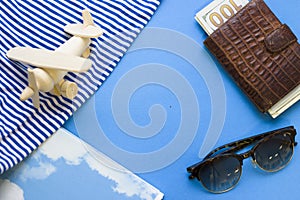 Travel concept blue background with beach essentials