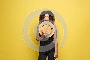 Travel concept - Close up Portrait young beautiful attractive African American woman with trendy hat smiling and joyful