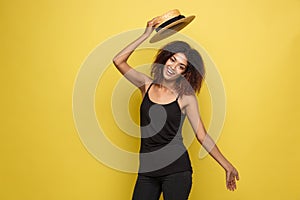 Travel concept - Close up Portrait young beautiful attractive African American woman with trendy hat smiling and joyful