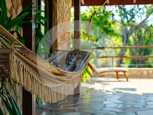 Travel concept with a hammock in a tropical beach with turquoise water in the background