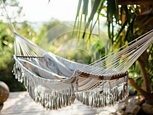 Travel concept with a hammock in a tropical beach with turquoise water in the background