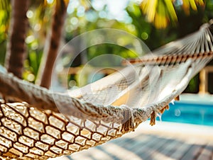 Travel concept with a hammock in a tropical beach with turquoise water in the background