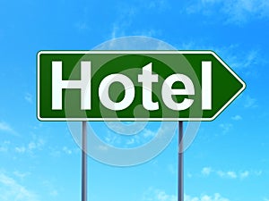 Travel concept: Hotel on road sign background