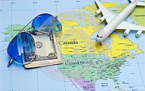 Travel concept with plan money passport sunglasses photo