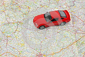 Travel concept, small car on map