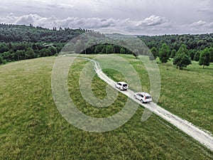 travel concept. two suv car riding by trail road