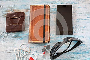 Travel concept with wallet , book, cell phone, glasses and headset
