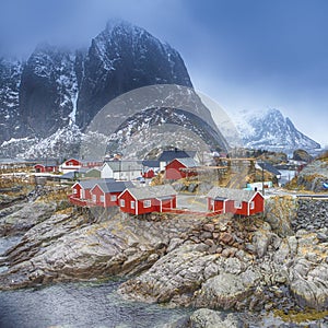 Travel Concepts and Ideas. Traditional Fishing Hut Village in Hamnoy Mountain Peak in Lofoten Islands,