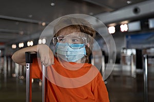 Travel. Coronavirus protection. Child face in a mask.