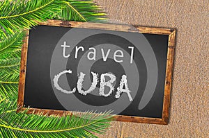 Travel Cuba palm trees and blackboard on sandy beach