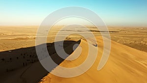Travel, desert and sunset with drone of sand dunes for destination, freedom and summer journey. Namibia, adventure and