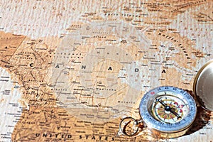 Travel destination Canada, ancient map with vintage compass