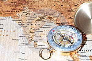 Travel destination India, ancient map with vintage compass