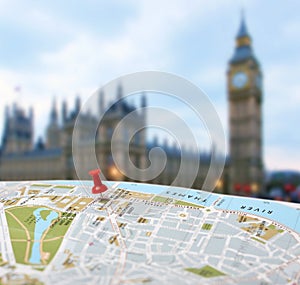 Travel destination London map push pin blur