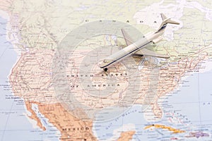 Travel destination USA. Passenger airplane miniature on a map