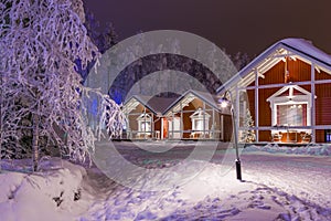 Travel Destinations Concepts. Line of Traditional Lapland Suomi Houses photo
