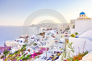 Travel Destinations. People Preparing for Sunset at Caldera Volcanic Slope of Oia Village in Santorini Island in Greece
